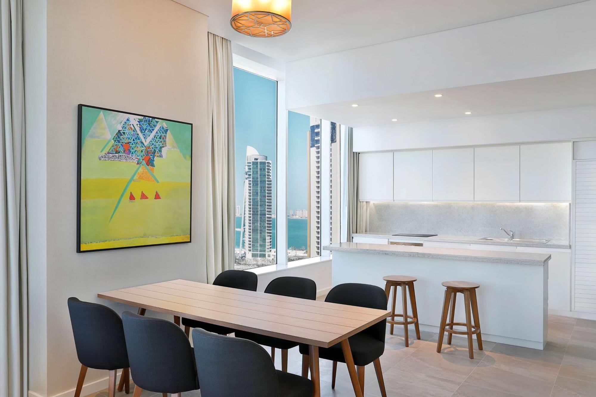 Aleph Doha Residences, Curio Collection By Hilton Dış mekan fotoğraf The kitchen and dining area of a typical apartment