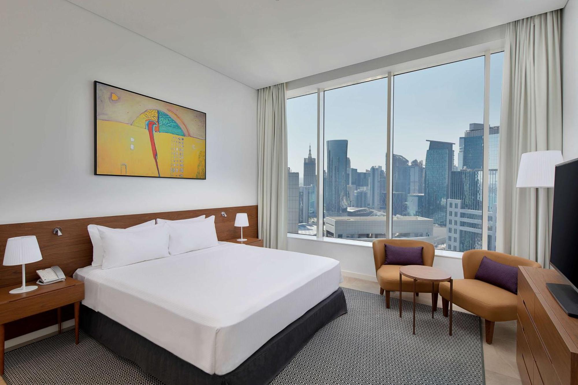Aleph Doha Residences, Curio Collection By Hilton Dış mekan fotoğraf A bedroom at the hotel