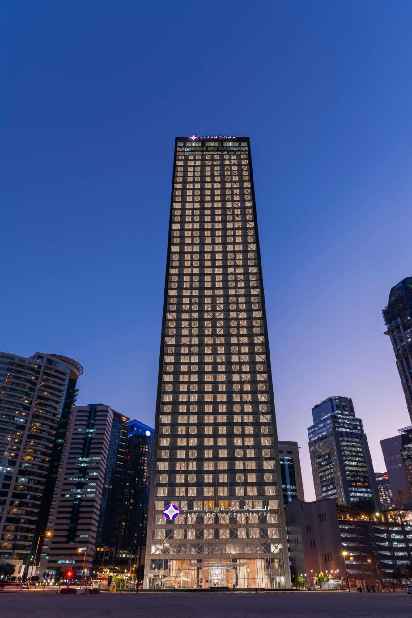 Aleph Doha Residences, Curio Collection By Hilton Dış mekan fotoğraf The building at night