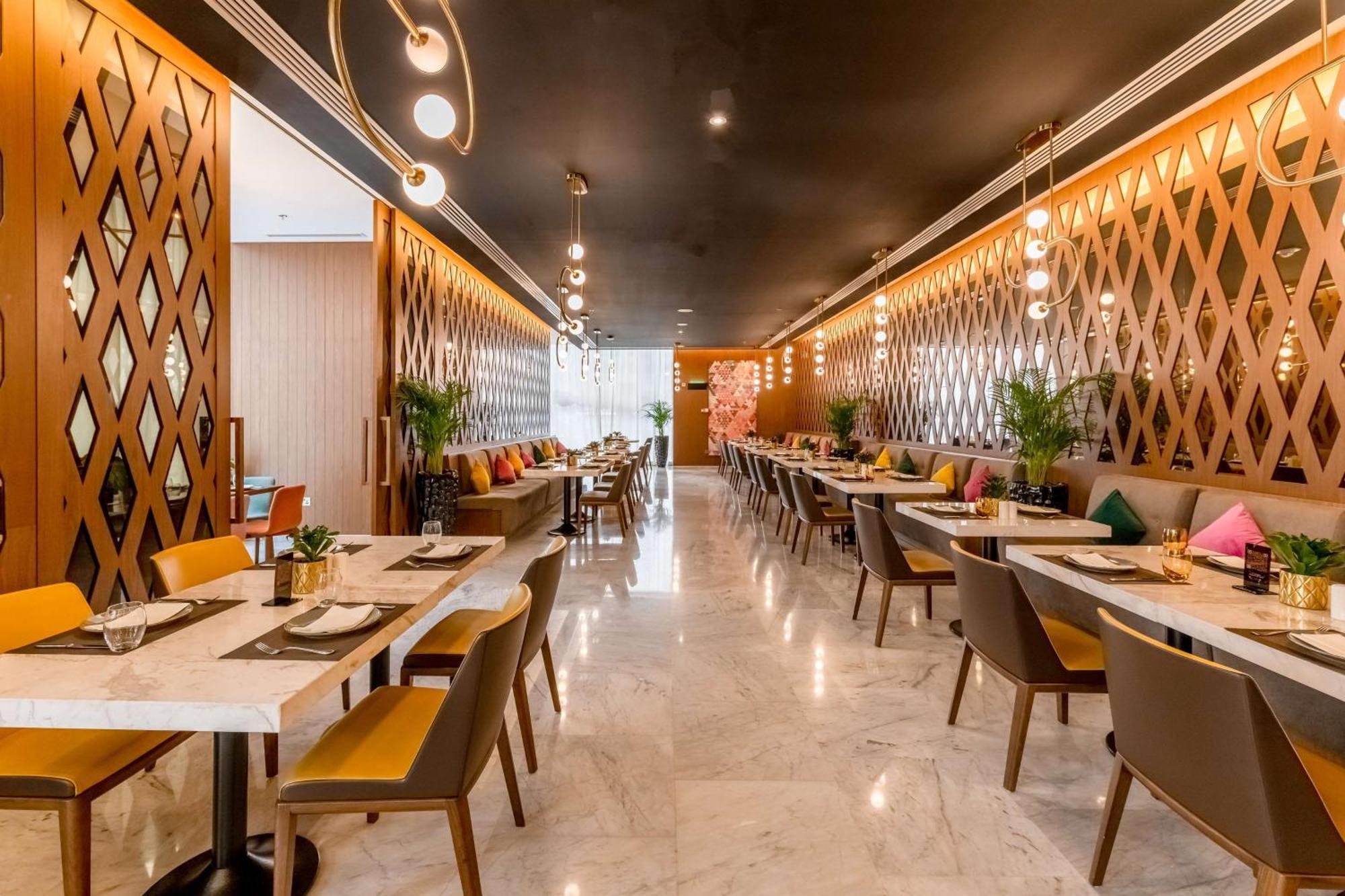 Aleph Doha Residences, Curio Collection By Hilton Dış mekan fotoğraf The interior of the restaurant