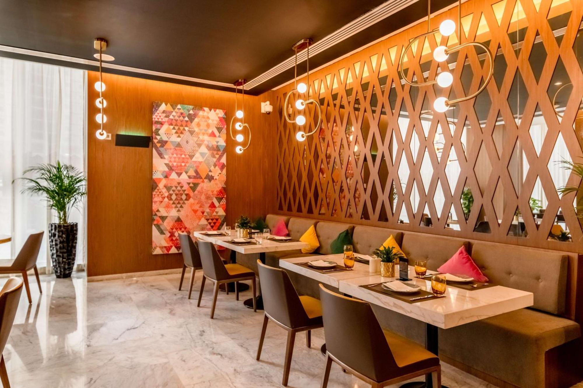 Aleph Doha Residences, Curio Collection By Hilton Dış mekan fotoğraf The interior of the restaurant
